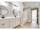 Bathroom with a double vanity, modern lighting, and a tub with shower, creating a spa-like experience at 453 Cedar Grove Rd, Clover, SC 29710