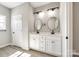 Elegant primary bathroom featuring double sinks and stylish lighting at 453 Cedar Grove Rd, Clover, SC 29710