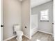 Modern bathroom with a toilet, shower and a window for ample light at 453 Cedar Grove Rd, Clover, SC 29710