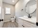 Bathroom featuring a modern vanity, toilet, and stylish fixtures at 453 Cedar Grove Rd, Clover, SC 29710
