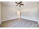 A bright bedroom featuring wood-look floors, a ceiling fan and doorway at 453 Cedar Grove Rd, Clover, SC 29710