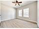 Spacious bedroom showcasing a ceiling fan, and natural light from windows at 453 Cedar Grove Rd, Clover, SC 29710