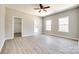 Spacious primary bedroom featuring a ceiling fan, ensuite, and large closet at 453 Cedar Grove Rd, Clover, SC 29710