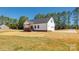 Charming home featuring white siding, a porch, an attached garage, and a well-maintained lawn at 453 Cedar Grove Rd, Clover, SC 29710