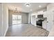 Eat-in kitchen boasts stainless appliances, white cabinets, and large sliding glass door at 453 Cedar Grove Rd, Clover, SC 29710
