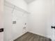 Small, unfinished laundry room with wood-look floors at 453 Cedar Grove Rd, Clover, SC 29710