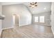 Bright living room features vaulted ceilings, wood-look floors, and neutral paint at 453 Cedar Grove Rd, Clover, SC 29710