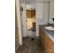 Bathroom featuring a combination of white tile and wood vanity with lots of counter space at 4946 A Tinkers Creek Rd, Edgemoor, SC 29712