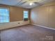 Simple bedroom with carpet floors and two windows providing lots of natural light at 4946 A Tinkers Creek Rd, Edgemoor, SC 29712