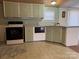 Efficient kitchen with white cabinets and essential appliances at 4946 A Tinkers Creek Rd, Edgemoor, SC 29712