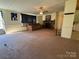 Open-concept living room with fireplace and lots of natural light at 4946 A Tinkers Creek Rd, Edgemoor, SC 29712
