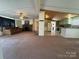 Spacious living room featuring a stone fireplace and comfortable seating area at 4946 A Tinkers Creek Rd, Edgemoor, SC 29712