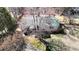 Aerial view of charming home with mature trees, providing shade and privacy at 5124 Gates Dr, Denver, NC 28037