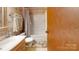 Bathroom featuring a vanity, toilet, and shower/tub combination with patterned wallpaper at 5124 Gates Dr, Denver, NC 28037