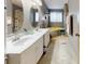 Bathroom with double sink vanity, a soaking tub, and neutral decor at 5124 Gates Dr, Denver, NC 28037