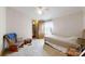 This bedroom has neutral carpet, a single bed, and a small closet for storing clothes at 5124 Gates Dr, Denver, NC 28037