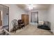 This bedroom features neutral carpeting, a ceiling fan, and lots of natural light from the window at 5124 Gates Dr, Denver, NC 28037