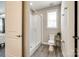 Modern bathroom featuring a glass-enclosed shower, toilet, and natural light from the window at 5316 Baker Ln, Clover, SC 29710