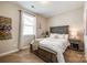 Comfortable bedroom with a queen-sized bed, side table, and soft lighting for relaxation at 5316 Baker Ln, Clover, SC 29710