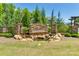 A stone entrance to the Lake Crest community with a water feature and lush landscaping at 5316 Baker Ln, Clover, SC 29710