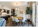 Dining space with view of the kitchen, a modern table, and a large plant at 5316 Baker Ln, Clover, SC 29710