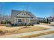 Charming home featuring a well-manicured lawn, inviting porch, and a two-car garage at 5316 Baker Ln, Clover, SC 29710