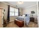 Comfortable bedroom with a large window, rocking chair, and a bed with blue patterned bedding at 5316 Baker Ln, Clover, SC 29710