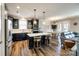 Open kitchen features a large island with seating, modern appliances, and sleek cabinetry at 5316 Baker Ln, Clover, SC 29710