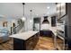 Kitchen boasts a large center island, stainless steel appliances, and stylish dark cabinetry at 5316 Baker Ln, Clover, SC 29710
