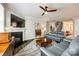 Spacious living room with a fireplace, ceiling fan, and comfortable seating area at 5316 Baker Ln, Clover, SC 29710