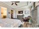 Comfortable main bedroom featuring a tray ceiling, ceiling fan, large dresser, and chair at 5316 Baker Ln, Clover, SC 29710