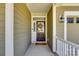 The front door with glass panels is accented by a decorative wreath and a welcome mat at 5316 Baker Ln, Clover, SC 29710