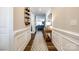 Hallway featuring hardwood floors, paneled walls, and an entryway into the living room at 5316 Baker Ln, Clover, SC 29710