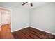 A cozy bedroom featuring sleek hardwood floors and a ceiling fan for added comfort at 544 Castlewood Cir, Rock Hill, SC 29730