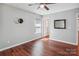 Bedroom featuring wood floors, natural light, and modern decorative wall hangings at 544 Castlewood Cir, Rock Hill, SC 29730