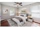 Bedroom featuring a decorative rug, ceiling fan and two windows for natural light at 544 Castlewood Cir, Rock Hill, SC 29730