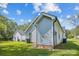 Exterior view of home with light siding and white trim, featuring grassy lawn and clear sky at 544 Castlewood Cir, Rock Hill, SC 29730