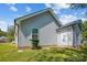 Side view of home with light siding and white trim, showing back entrance and grassy yard at 544 Castlewood Cir, Rock Hill, SC 29730