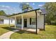 Charming home featuring a covered front porch with white columns and a well-maintained lawn at 544 Castlewood Cir, Rock Hill, SC 29730
