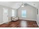Bright living room with vaulted ceiling, ceiling fan, wood floors and a loveseat at 544 Castlewood Cir, Rock Hill, SC 29730