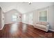 Bright living room with vaulted ceiling, ceiling fan, wood floors and a loveseat at 544 Castlewood Cir, Rock Hill, SC 29730