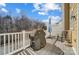 Cozy deck with a grill, white railings, an umbrella and seating to enjoy the outdoor space at 582 Sixth Baxter Xing, Fort Mill, SC 29708
