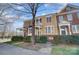 Beautiful townhouse exteriors with well-kept landscaping, covered porches, and varied architectural designs at 582 Sixth Baxter Xing, Fort Mill, SC 29708
