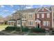 Charming townhomes with landscaped front yards, covered entrances, and a mix of brick and siding facades at 582 Sixth Baxter Xing, Fort Mill, SC 29708
