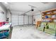 Spacious garage with a white door, storage shelves and additional seating at 582 Sixth Baxter Xing, Fort Mill, SC 29708