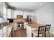 Open kitchen with granite countertops, white cabinetry, and stainless steel appliances at 582 Sixth Baxter Xing, Fort Mill, SC 29708