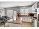 Open concept kitchen and dining area with island and stainless steel appliances at 582 Sixth Baxter Xing, Fort Mill, SC 29708