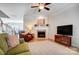 Comfortable living room featuring a fireplace, ceiling fan, and neutral colored decor at 582 Sixth Baxter Xing, Fort Mill, SC 29708