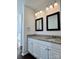 Elegant bathroom with granite countertop, dual sinks, vanity, and modern lighting at 5905 Waverly Lynn Ln, Charlotte, NC 28269