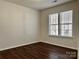 Bedroom features neutral paint, durable flooring, and lots of natural light at 5905 Waverly Lynn Ln, Charlotte, NC 28269